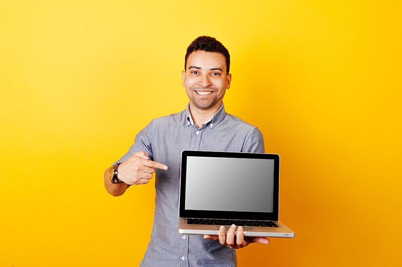 man holding laptop